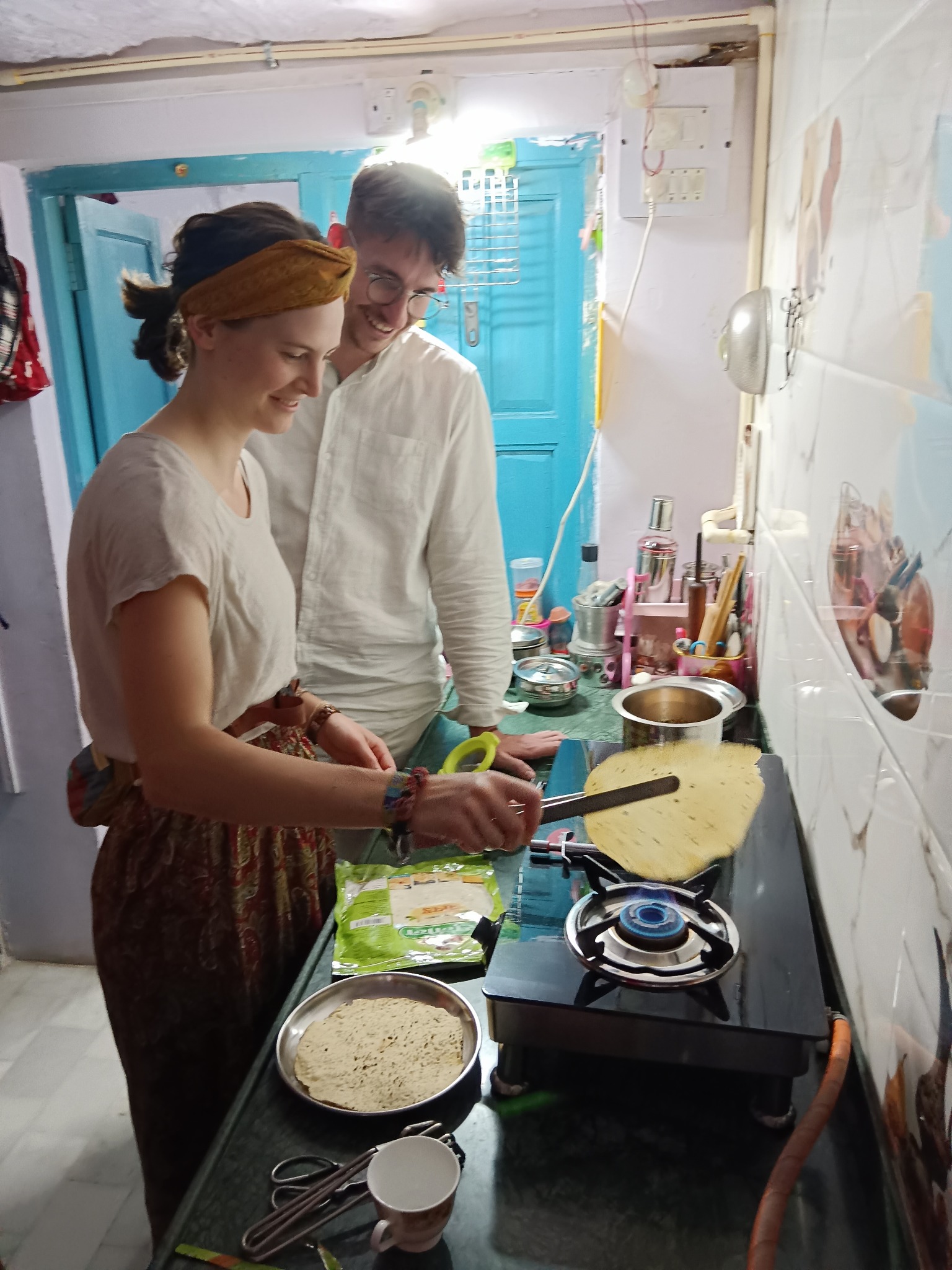 Guests cooking traditional Indian flatbread