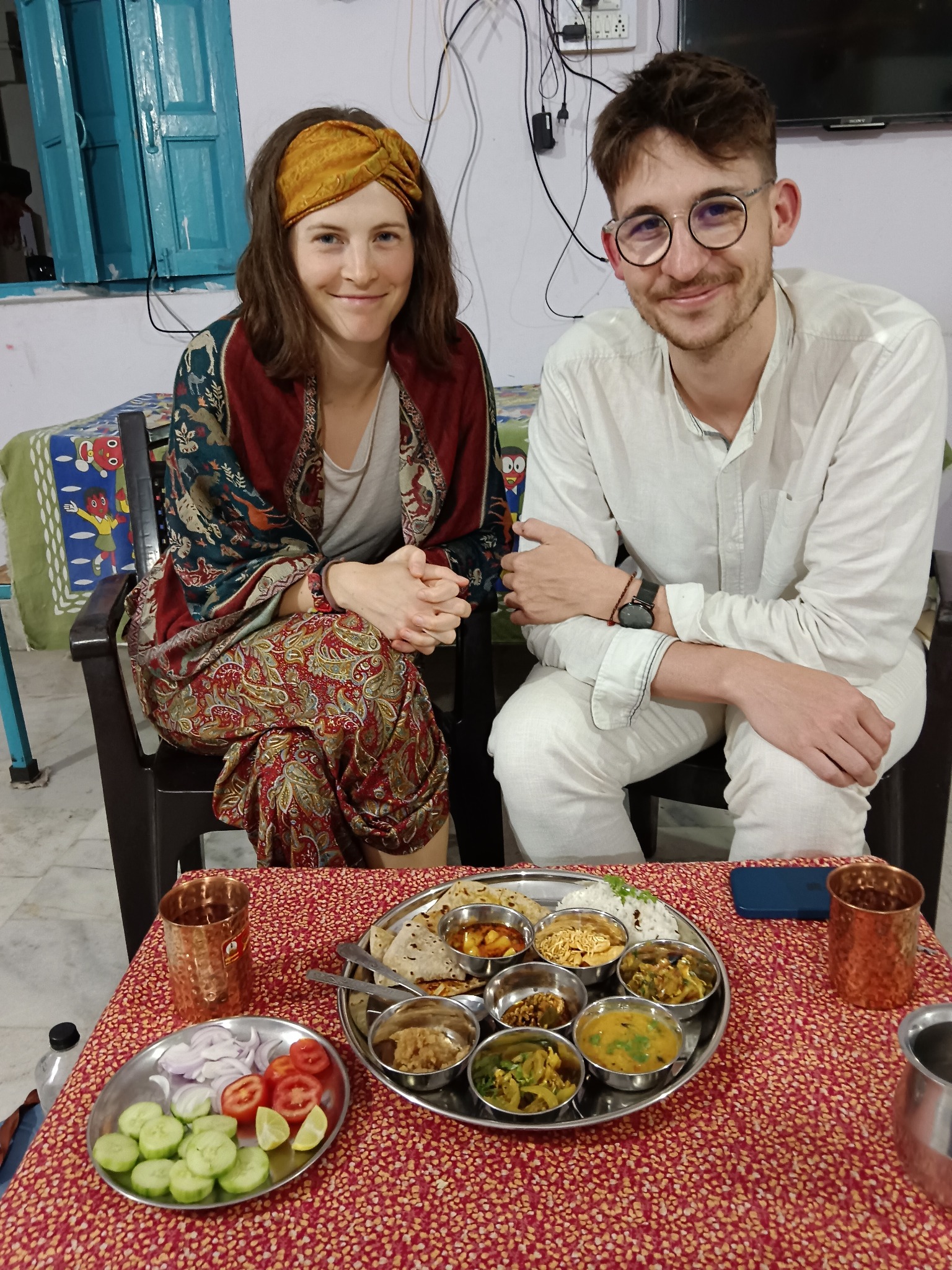 Couple enjoying a Rajasthani thali meal